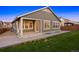 Exterior view of a home's back porch, siding, and yard at 10049 Isle St, Parker, CO 80134