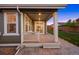 Inviting back porch area with patio stone and a well-manicured backyard at 10049 Isle St, Parker, CO 80134