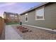 Backyard exterior view of raised garden beds with rock and walkway at 10049 Isle St, Parker, CO 80134