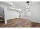 Basement featuring wood floors, pendant lighting and a carpeted living area at 10049 Isle St, Parker, CO 80134