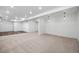 Spacious basement area features carpeted and wood floors, recessed lighting and white walls at 10049 Isle St, Parker, CO 80134