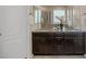Bathroom featuring a double vanity with granite countertops and a separate glass-enclosed shower at 10049 Isle St, Parker, CO 80134