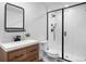Bathroom featuring a modern vanity, toilet and a glass enclosed shower at 10049 Isle St, Parker, CO 80134