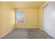 Bright bedroom with carpet, a closet, and natural light from the window at 10049 Isle St, Parker, CO 80134
