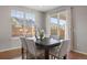 Bright dining area with large window and sliding glass door to the backyard at 10049 Isle St, Parker, CO 80134