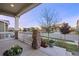 Charming front porch with stone accents, flowers, and neighborhood views at 10049 Isle St, Parker, CO 80134