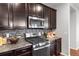 Modern kitchen equipped with stainless steel appliances and sleek countertops at 10049 Isle St, Parker, CO 80134