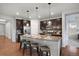 Kitchen features granite countertops, dark cabinetry, stainless steel appliances, and seating at 10049 Isle St, Parker, CO 80134
