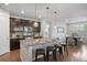 Modern kitchen features a large island, stainless appliances, and an adjacent dining area at 10049 Isle St, Parker, CO 80134