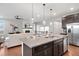 Spacious kitchen with a center island, modern appliances, and an open-concept layout at 10049 Isle St, Parker, CO 80134
