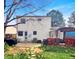 View of the backyard featuring a deck, patio, and a well maintained lawn at 10781 Moore St, Westminster, CO 80021