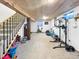 Finished basement featuring a staircase, neutral carpet, wooden ceiling, workout and recreational area at 10781 Moore St, Westminster, CO 80021