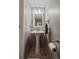 This half bath is designed with a pedestal sink, neutral walls, and modern fixtures for a fresh, clean look at 10781 Moore St, Westminster, CO 80021