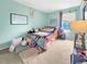 A playful bedroom with a unique bed setup, plush rugs, and decor; carpeted flooring at 10781 Moore St, Westminster, CO 80021
