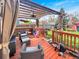 Outdoor deck with patio furniture, overhead shade, lawn, and outdoor exercise equipment at 10781 Moore St, Westminster, CO 80021