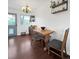 Bright dining area features a wood table, stylish chairs, and a view of the outdoors at 10781 Moore St, Westminster, CO 80021