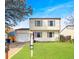 Charming two-story home with manicured lawn, attached garage, and inviting curb appeal at 10781 Moore St, Westminster, CO 80021