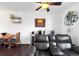 Cozy living room boasts hardwood floors, comfortable leather seating, and decor at 10781 Moore St, Westminster, CO 80021
