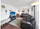 Spacious living room features hardwood floors, a large television, and comfortable seating at 10781 Moore St, Westminster, CO 80021