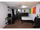 Finished basement space with a desk, and dark wood furniture offering versatile usage options at 1134 Del Mar Pkwy, Aurora, CO 80010