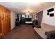 Spacious finished basement featuring carpet, wood paneling, and ample room for recreation and relaxation at 1134 Del Mar Pkwy, Aurora, CO 80010