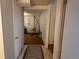 Basement hallway with access to another room featuring neutral walls and a decorative hanging chair at 1134 Del Mar Pkwy, Aurora, CO 80010