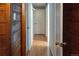 Hallway with hardwood floors and multiple doors at 1134 Del Mar Pkwy, Aurora, CO 80010