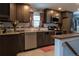 Modern kitchen features stainless steel appliances, dark cabinets, white subway tile, and light countertops at 1134 Del Mar Pkwy, Aurora, CO 80010