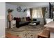 Inviting living room with a large window, stylish decor, hardwood floors, and a comfortable seating area at 1134 Del Mar Pkwy, Aurora, CO 80010