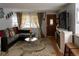 Inviting living room with a large window, stylish decor, hardwood floors, and a comfortable seating area at 1134 Del Mar Pkwy, Aurora, CO 80010