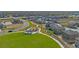 Aerial view of community featuring a lush green park, walking trails, picnic shelter, and modern, well-maintained homes at 4115 Marble Dr, Mead, CO 80504
