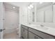 Stylish bathroom featuring a double vanity, tiled floor, and a shower/tub combo at 4115 Marble Dr, Mead, CO 80504