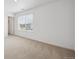 Well-lit bedroom with neutral carpet and a large window providing pleasant natural light at 4115 Marble Dr, Mead, CO 80504