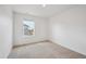 Bright, empty room features neutral walls, carpeted floors, and window bringing in natural light at 4115 Marble Dr, Mead, CO 80504