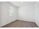 Bright, empty room features neutral walls, light-colored floors, and window bringing in natural light at 4115 Marble Dr, Mead, CO 80504
