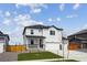 Charming two-story home features a covered porch, attached two-car garage, and a well-maintained lawn at 4115 Marble Dr, Mead, CO 80504