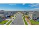 Neighborhood street view showcasing well-manicured lawns, attractive landscaping, and modern home exteriors with front-facing garages at 4115 Marble Dr, Mead, CO 80504