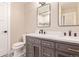 Bathroom featuring double vanity, stylish tile floor, and a framed mirror at 230 E Highline Cir # 101, Centennial, CO 80122