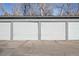 Attached garage with a white door in a well-maintained neighborhood at 230 E Highline Cir # 101, Centennial, CO 80122