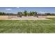Well-maintained baseball field with green grass and clear skies for outdoor recreation at 3695 S Kittredge St # C, Aurora, CO 80013