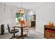 Cozy dining area adjacent to the kitchen with sliding glass door to the back patio at 3695 S Kittredge St # C, Aurora, CO 80013