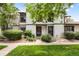 Inviting townhome exterior featuring well-maintained landscaping, a walkway, and visible unit numbers at 3695 S Kittredge St # C, Aurora, CO 80013