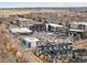 Commercial area with retail spaces, parking lots, and residential buildings in the surrounding neighborhood at 89 Oneida St, Denver, CO 80230