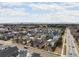 Expansive aerial view of a well-planned community showcasing diverse homes and a picturesque landscape at 89 Oneida St, Denver, CO 80230