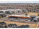 Aerial shot featuring a commercial development adjacent to the residential area with parking and retail at 89 Oneida St, Denver, CO 80230