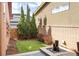 Landscaped backyard with artificial grass and a water feature at 89 Oneida St, Denver, CO 80230
