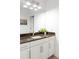 Bright bathroom with a spacious vanity, granite countertop, and ample lighting at 89 Oneida St, Denver, CO 80230
