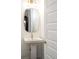 Stylish half bath featuring a pedestal sink, modern fixtures, and a clean, minimalist design at 89 Oneida St, Denver, CO 80230