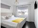 Modern bedroom with a large window and sleek, minimalist design at 89 Oneida St, Denver, CO 80230
