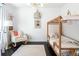 Bright bedroom featuring a stylish four-poster bed and decor at 89 Oneida St, Denver, CO 80230